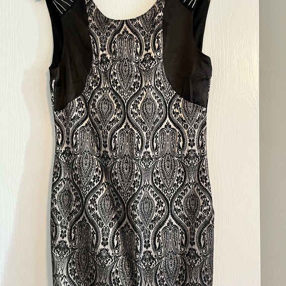 Fitted black and silver dress with beaded shoulder treatment. - Picture 2 of 4